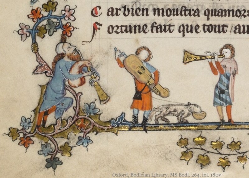 A musician holds the leash of a guide dog, who has a bowl in his mouth. The man is playing a stringed instrument. He is wearing an orange tunic with a black bag and black shoes; his face is blank and he has yellow hair.